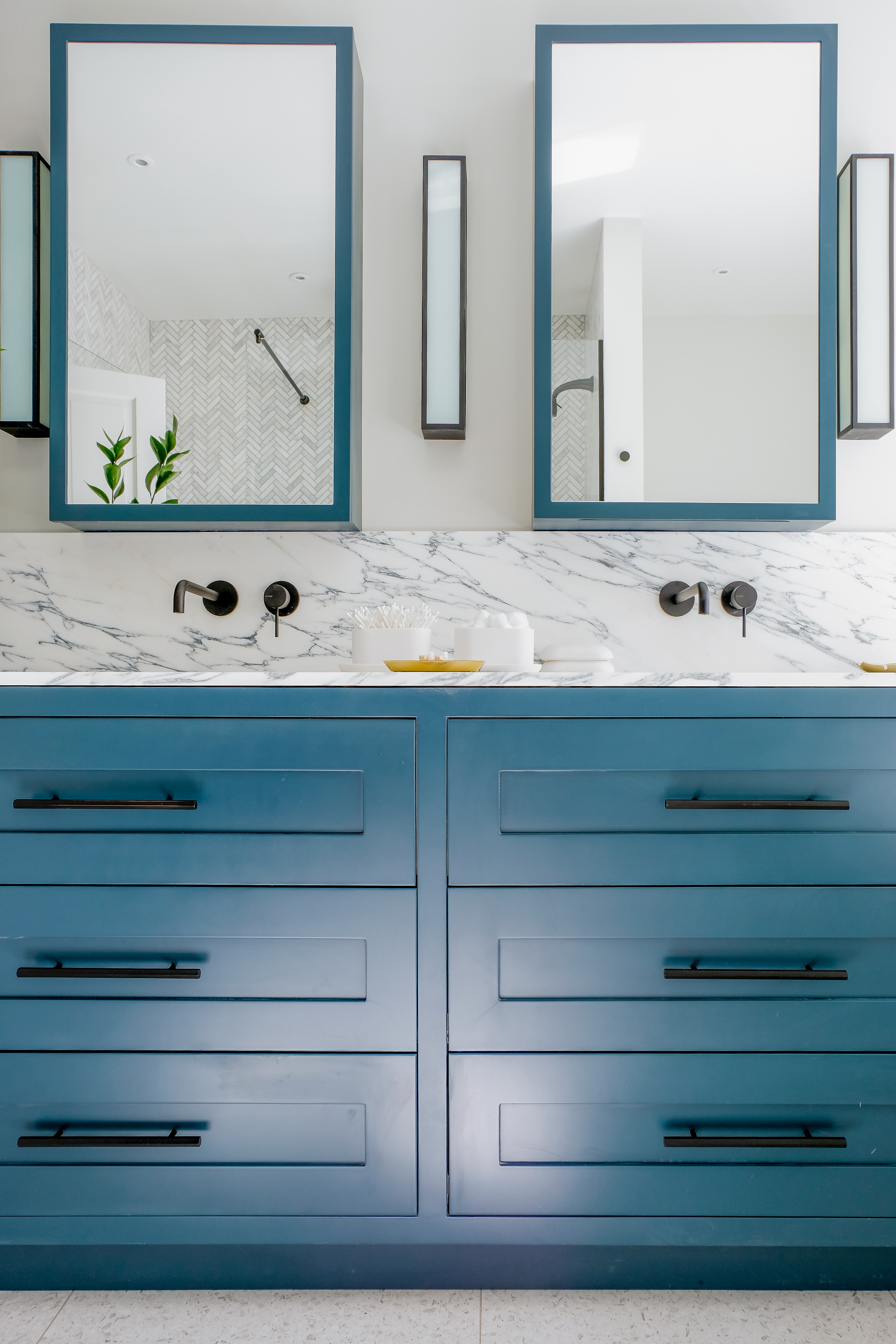 Blue double marble counter vanity sink in bathroom with two matching mirrors