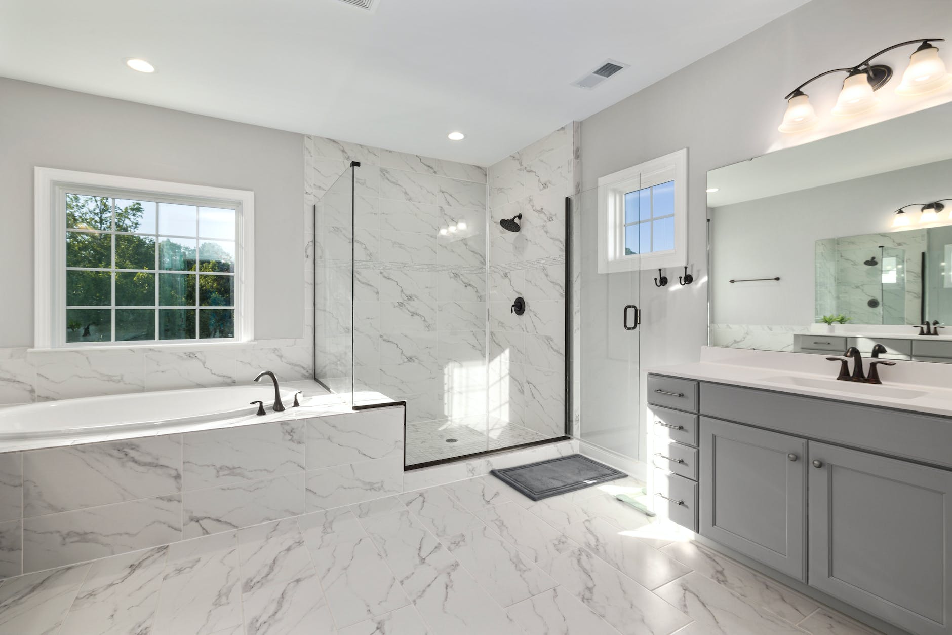 a white and grey luxury bathroom representing what could be created by a Kamloops Plumbing Services company